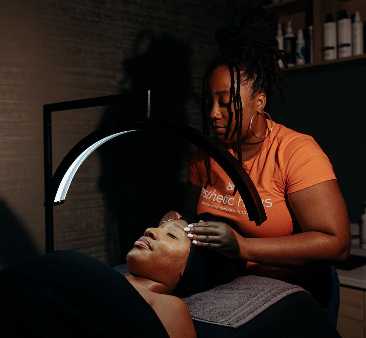 a man and a woman sitting in a dark room